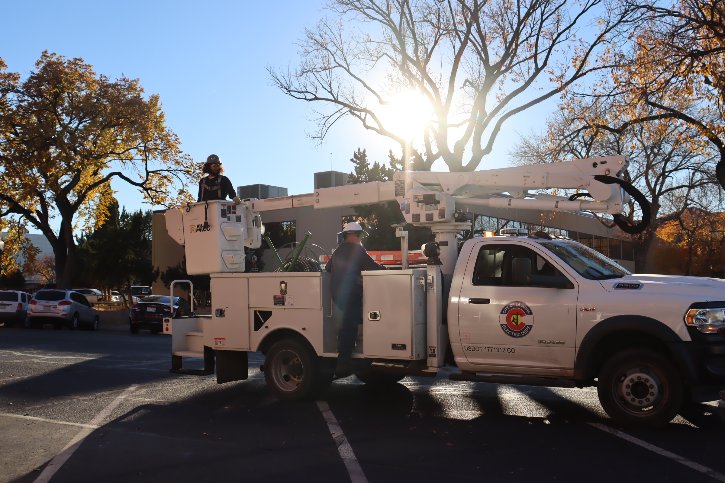 La Junta City Crew Hanging Christmas Garland SECO News seconews.org